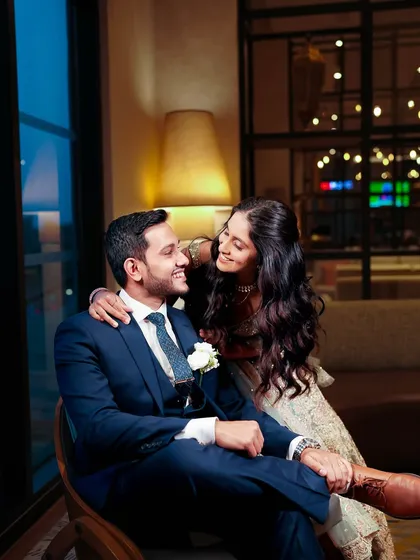 An intimate and happy moment. The bride's makeup looks soft and beautiful even in this close-up shot.