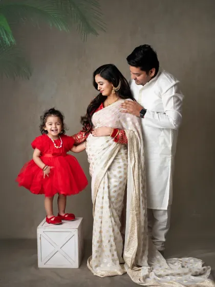 Welcoming a new baby is a journey for the whole family. This beautiful maternity portrait captures the excitement of a big sister-to-be, celebrating the love that's about to grow.