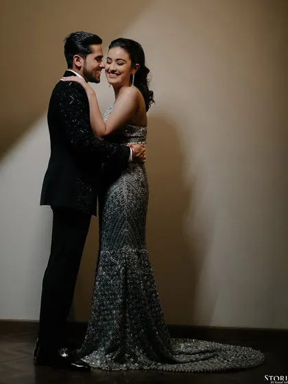 A happy, candid moment between the couple, their smiles showing the joy of their engagement celebration.