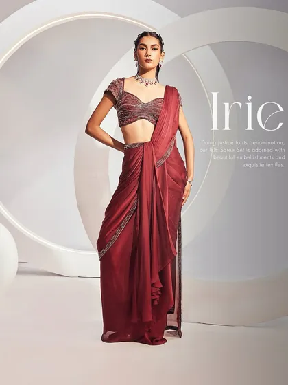 Our IRIE Saree Set is a study in contemporary couture. This full-length view in a rich maroon showcases the pre-draped concept saree and a fully embellished sweetheart blouse, creating a sophisticated and modern ethnic look.