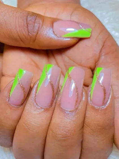 A modern design with a nude base, neon green color blocks, and a delicate, wavy line of rose gold glitter. The combination of colors and textures is unique and stylish.