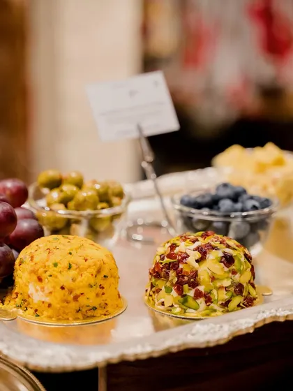 An assortment of my cheese domes on a silver platter. This shows the variety of flavours and textures I offer, from the spicy cheddar to the sweet cranberry and pistachio.