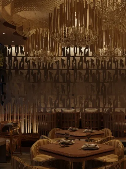 The ceiling at Zuvaah features dramatic, custom-made chandeliers that resemble hanging roots or vines, reinforcing the organic, underground theme. The walls are adorned with abstract, script-like patterns.