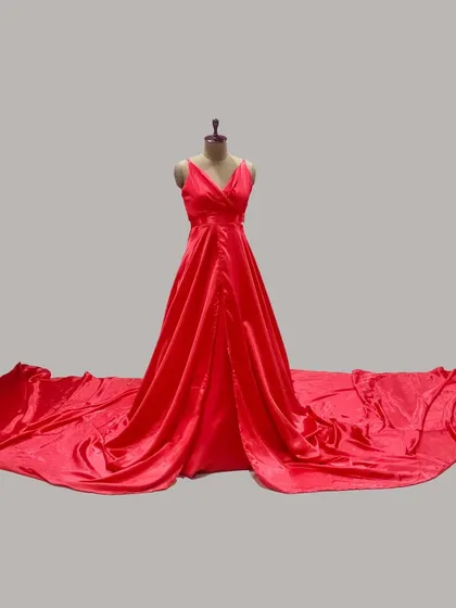 This is our classic red satin maternity gown, designed with an extra-long trail. It is the ideal choice for creating dramatic 'flying gown' effects in your outdoor photoshoots.