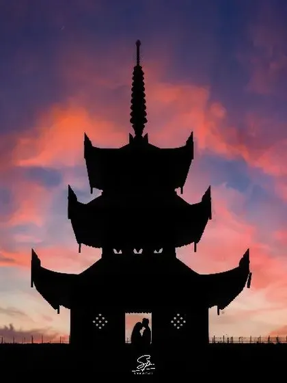 We love getting creative to tell your love story. This dramatic sunset silhouette from a pre-wedding shoot turns a simple kiss into a piece of art, showcasing our passion for unique and memorable couple portraits.