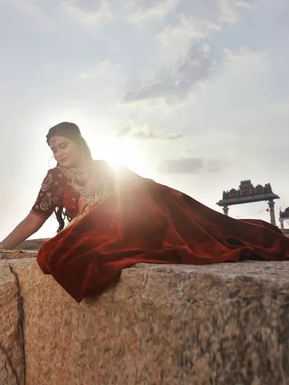 Playing with the setting sun to create a beautiful lens flare. This technique adds a warm, dreamy quality to the image while silhouetting the model's form.