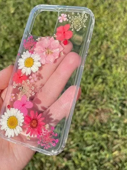 Protect your phone with a personal touch. This custom floral phone case is made with real, carefully placed pressed flowers, all sealed in crystal-clear resin. You can choose the flowers and layout to match your style perfectly.