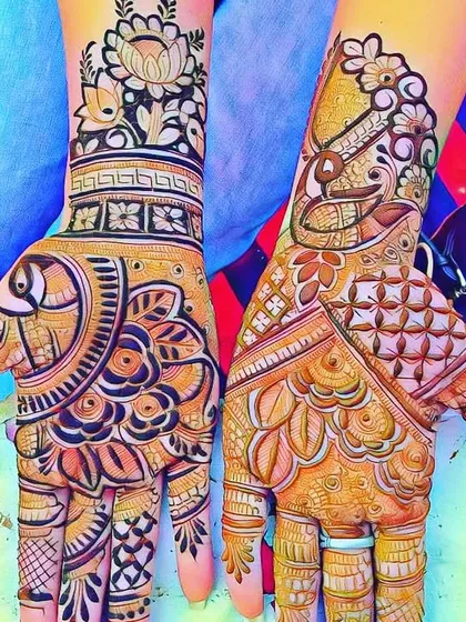A creative design featuring a mix of motifs, including a fish on one palm and a lotus on the other wrist. This shows how we can mix different elements to create a unique pattern.