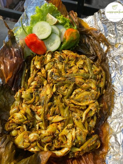 My special Nganam, a steamed fish preparation wrapped and cooked in turmeric leaves. The leaves give the fish a beautiful aroma and flavor.