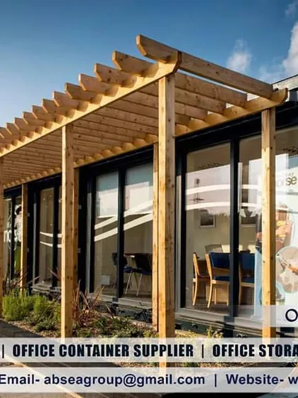 This office container features a stylish wooden pergola, large glass windows, and a modern aesthetic. It proves that site offices can be both functional and architecturally sophisticated.