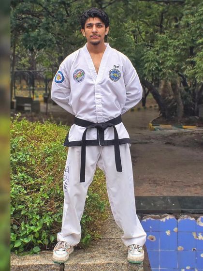 In my full Taekwondo uniform, ready to teach. I lead by example, embodying the discipline and respect that I expect from all my students.