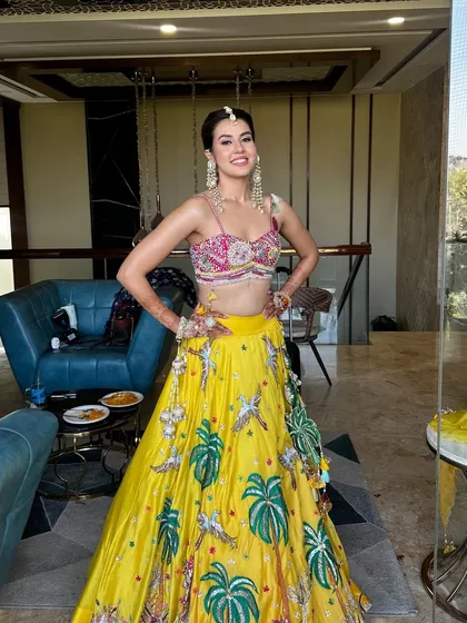 The full Haldi look. The bright, fun outfit is paired with makeup that is radiant and joyful, perfect for the occasion.