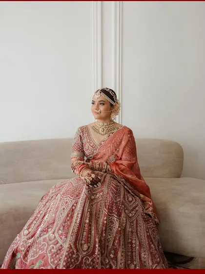 A moment of quiet reflection. I styled this portrait of the bride seated on a modern sofa to contrast with her traditional Ronak and Shruti lehenga, creating a contemporary image that still feels timeless and regal.