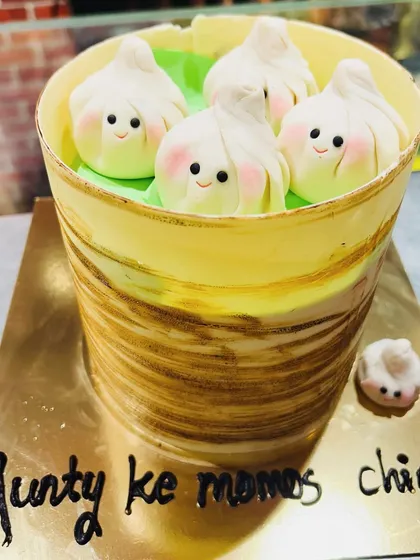 Who wants momos? This cake was a hilarious and delicious surprise, designed to look exactly like a steamer basket filled with cute, smiling dumplings. It's a perfect example of how I can turn any favorite food into a unique cake.