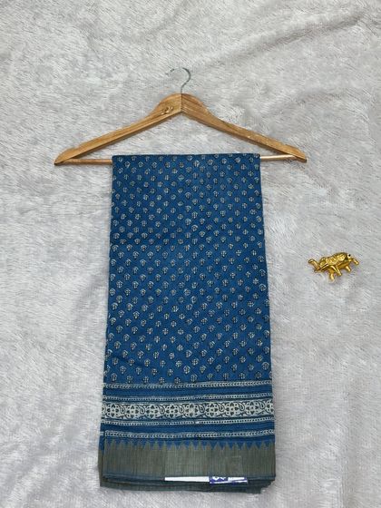 A deep blue Maheshwari silk saree with delicate Bagru block prints. The lightweight fabric and elegant design make it perfect for both work and special occasions.