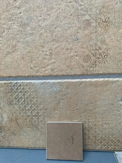 Experimenting with textures by imprinting local stone tiles. This hands-on approach to materiality allows me to create unique surfaces that tell a story and add a sensory richness to the finished space.
