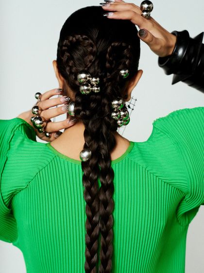 The back of my hair for the Vogue event, braided and adorned with silver spheres for a futuristic, sculptural feel.