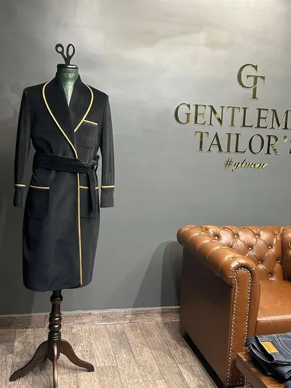 Displayed in our showroom, the black and yellow smoking jacket is a testament to our ability to create unique, personalized pieces.