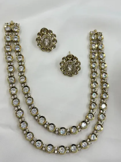 A simple yet elegant two-layer antique finish necklace with polki stones.