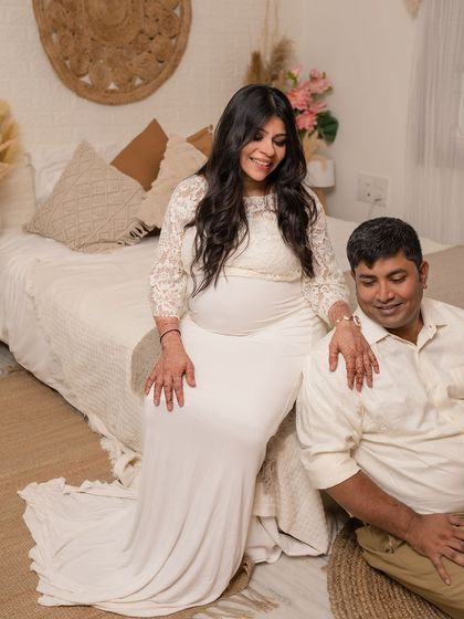 A cozy and intimate maternity portrait in our boho-chic bedroom set.