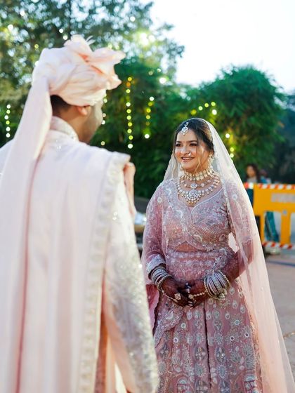 A precious "first look" moment between the bride and groom. My long-lasting makeup ensures she looks perfect for every important memory.