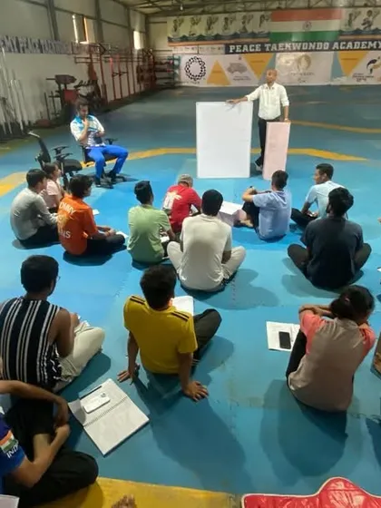 A wide view of the workshop, showing the engagement of our athletes in learning the theoretical side of Taekwondo.