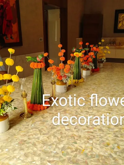 A playful and modern take on traditional centerpieces. We used marigolds to create lollipop-style arrangements in rustic ceramic pots for a fun and unique table setting.