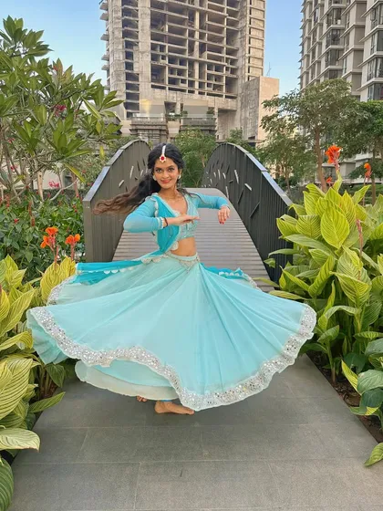 A series of photos capturing the twirls and graceful movements of semi-classical dance. The flow of the lehenga is essential to the visual beauty of this style.