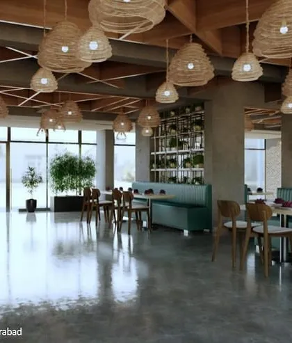 The cafeteria at Amity University's hostel block in Hyderabad. We used natural materials like wood and wicker, along with abundant greenery, to create a refreshing and relaxing dining environment that connects with the outdoors.