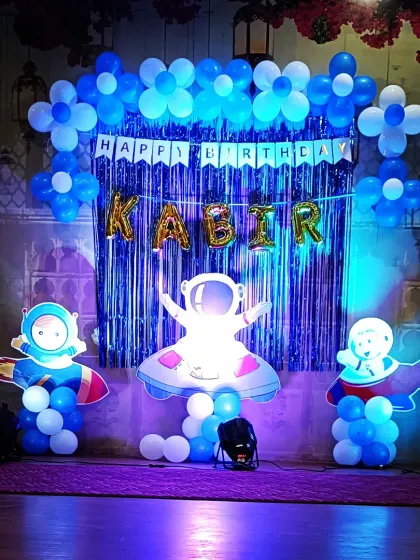 For a child who dreams of the stars, I created this out-of-this-world space theme. The setup for Kabir's birthday included astronaut cutouts, a galaxy-inspired balloon arrangement, and a shimmering blue backdrop to give the feel of a real space mission.