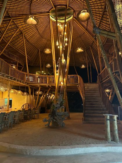 A stunning example of bamboo architecture, where the material is used for everything from the structural columns to the furniture and railings.