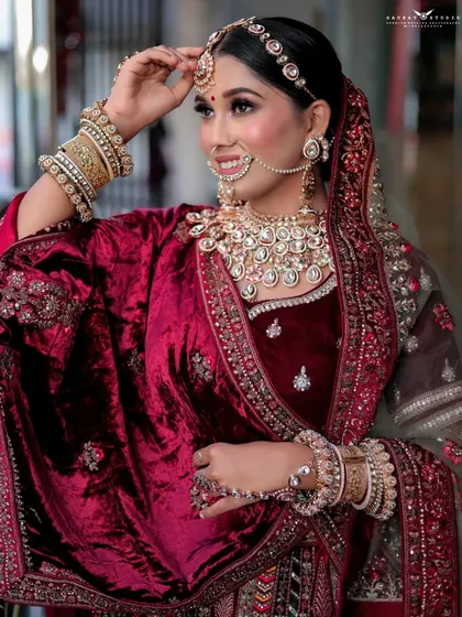 A happy, smiling portrait that brings out the bride's personality, set against a simple background.