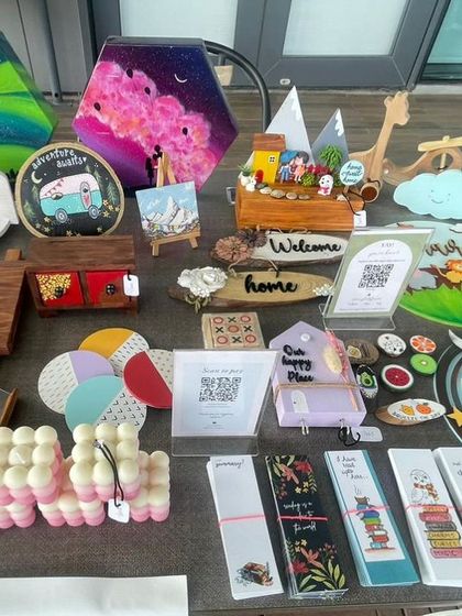 A close-up of my stall display. You can see the variety of items I offer, including kids' decor, name signs, small furniture pieces, and other handcrafted home goods.