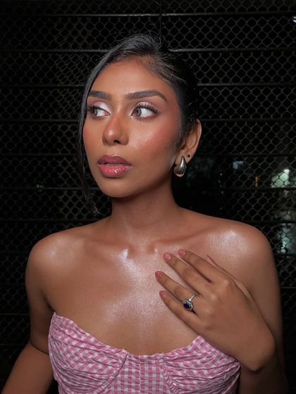 Look at that glow! This is the result of careful skin prep and highlighting techniques to create a 'glass skin' effect. The makeup feels light and lets her natural beauty shine through.