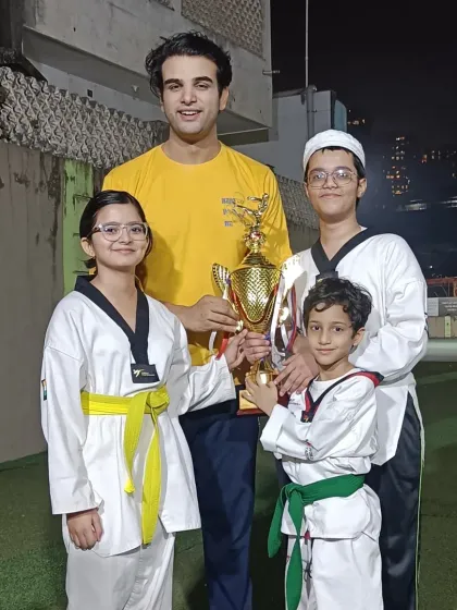A proud coach with his champions. Guiding these students to victory is one of the most rewarding parts of my job.