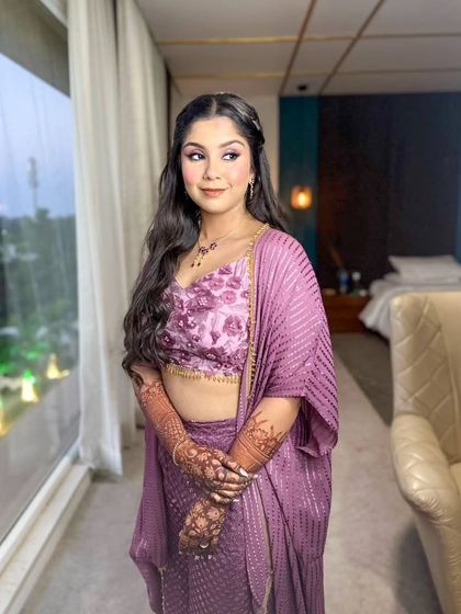 A happy and confident portrait of the bride in her unique purple Haldi outfit.
