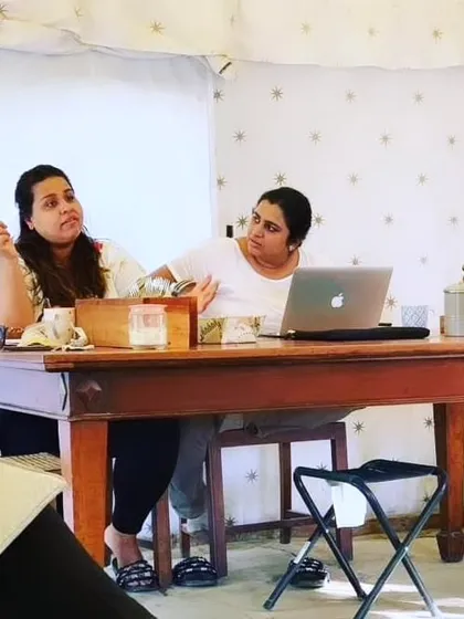 A behind-the-scenes shot of our founders, Khyati and Pooja, during a work session. This image captures the dedication and collaboration that goes into planning every event.