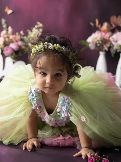 A sweet moment on the move. This crawling shot shows her playful side amidst the beautiful, whimsical setting of her first birthday session.
