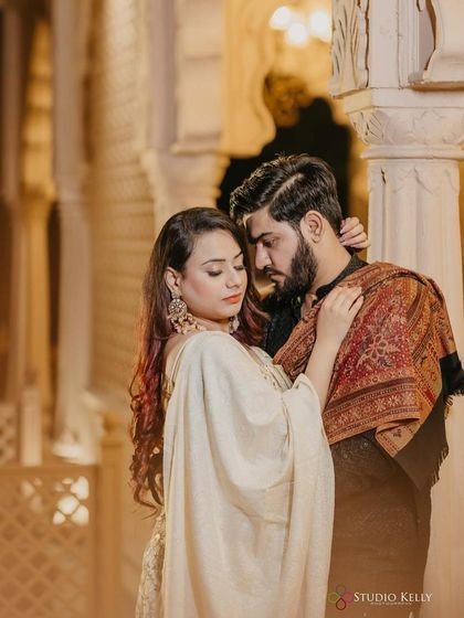 An intimate and traditional pose from the pre-wedding shoot. The makeup features a soft smokey eye and a neutral lip, perfect for this classic and romantic shot.