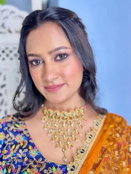 Another angle of the smokey eye look, showing the seamless blend of colors. The skin is kept fresh and glowing to balance the bold eyes.