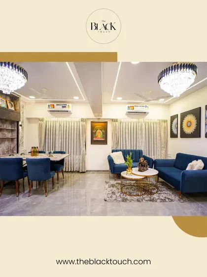 An expansive living and dining area designed with a royal blue and grey color scheme. The crystal chandeliers and plush velvet chairs add a touch of glamour, while the open layout makes it ideal for hosting large gatherings.