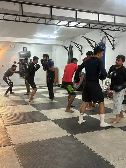 Students practicing their shadow boxing and footwork in a group setting. This helps build muscle memory and ensures everyone is on the same page with the fundamentals.