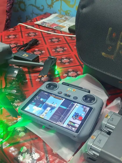A view from my perspective. The DJI RC controller with its bright screen allows me to perfectly frame the shot, as seen here while preparing to film boats on the water.