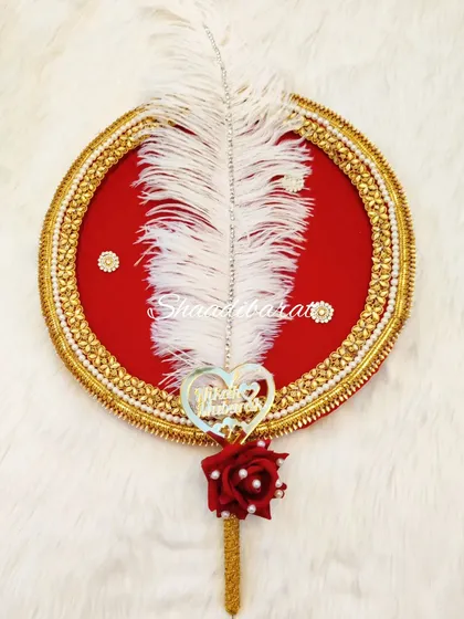 A simple yet elegant Nikah platter featuring a red velvet base, a decorative feather, and a custom pen. This can be used to present the pen during the ceremony.