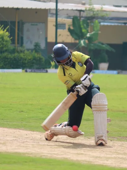 A batter plays a sweep shot, a crucial skill for playing against spin bowling that we practice extensively.