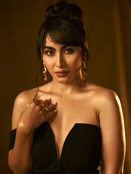Classic Hollywood glamour for the beautiful Khatija Iqbal. This look features a deep plunging neckline, so the focus is on radiant, glowing skin, a sophisticated top knot, and elegantly defined eyes.