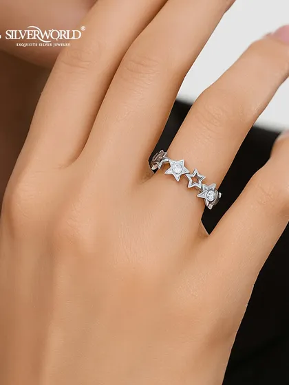 A playful and chic eternity band featuring a series of star shapes, some of which are filled with sparkling zirconia. Perfect for stacking or wearing alone.