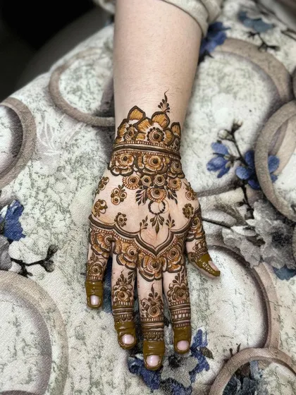 A single hand, showing the details of the back-of-hand design.