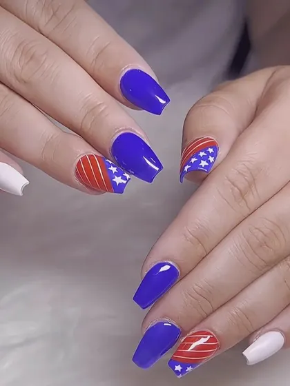 A patriotic theme with red, white, and blue nails featuring stars and stripes, perfect for special holidays or events.
