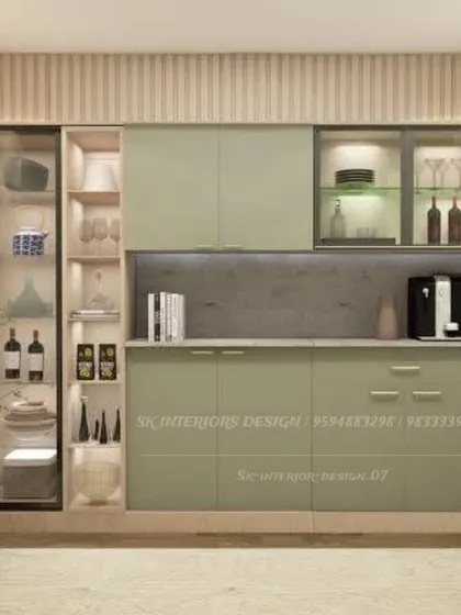 A beautiful crockery unit in a sage green finish with integrated display shelves. The design includes both open and closed storage, with glass-front cabinets for showcasing special items.